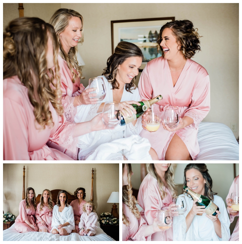 Bride and bridesmaids toast champagne as they get ready on the wedding day at The Tides Inn in Irvington, Virginia.
