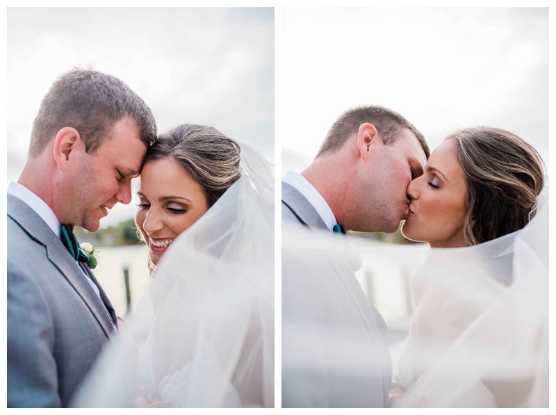 Bride and groom kiss during wedding day portraits at The Tides Inn in Irvington, Virginia.