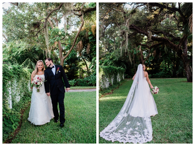 Bride with cathedral lace veil poses amongs Spanish moss adorned trees in Estero, Florida.