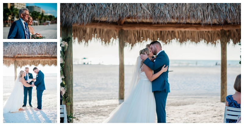 Bride and groom share first kiss as husband and wife under tiki on the beach of the JW Marriott Marco Island Beach Resort