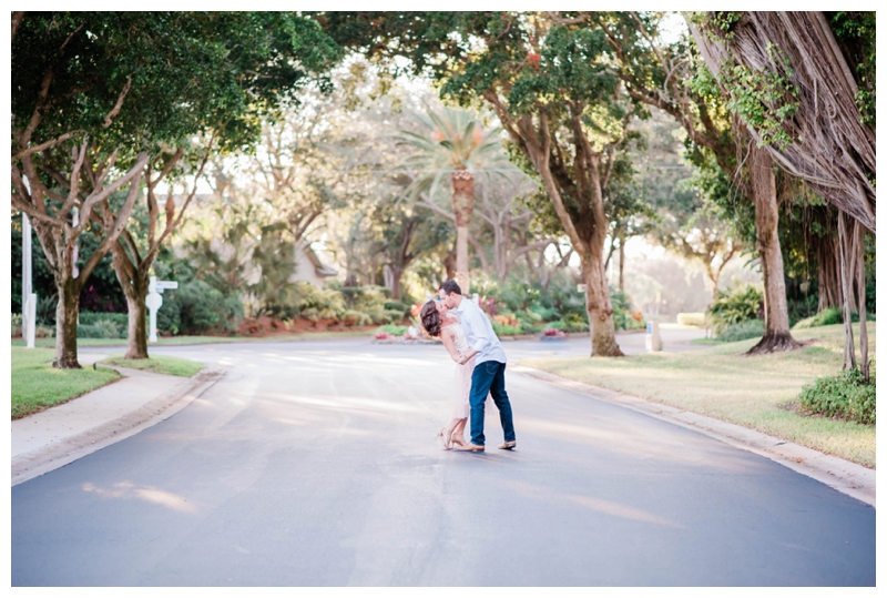 Bride and groom to be share a kiss underneath a banyan tree in Fort Myers, Florida.