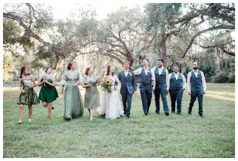 Fort Myers Florida bridal party celebrates together during outdoor ceremony.