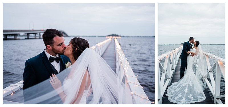 Bride and groom kiss on boardwalk on rainy Florida wedding day