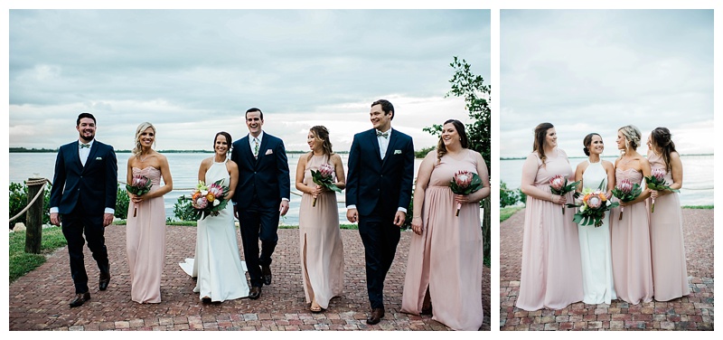 Bridesmaids in pale pink and groomsmen in navy suits celebrate the Florida newlyweds
