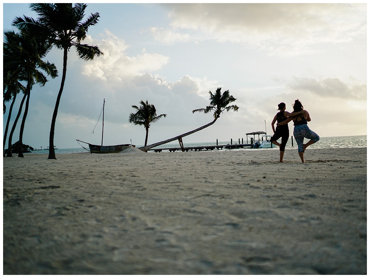 Two Fort Myers wedding photographers do yoga on the beach in Islamorada, Florida