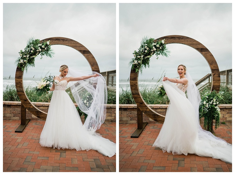 Bride twirls in front of wedding day arbor on Southwest Florida wedding day