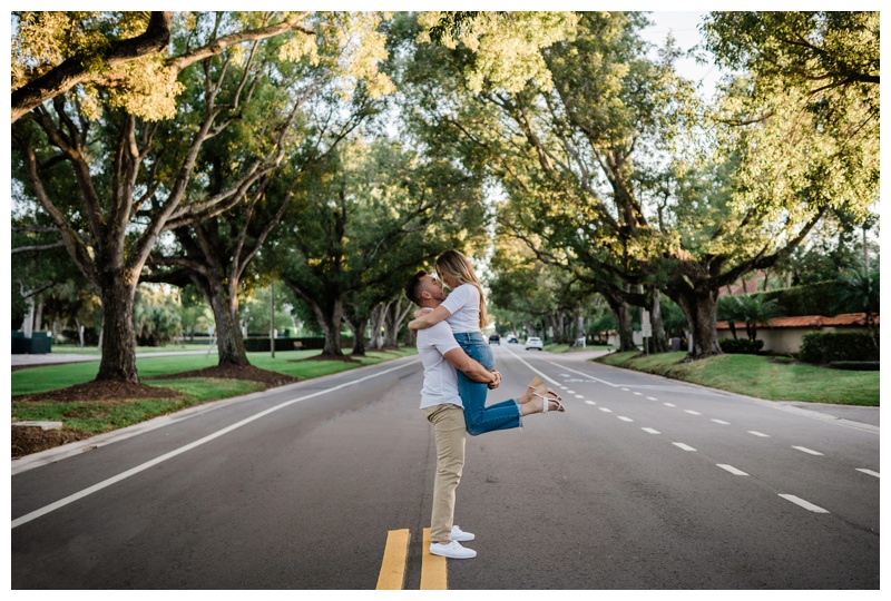 Florida couple embraces on tree lined street in Port Royal neighborhhood, Florida