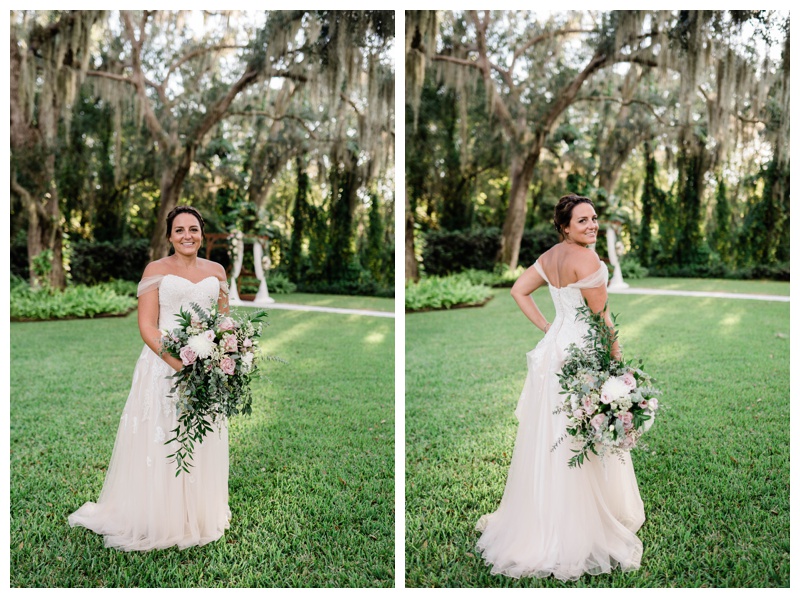Florida bride stands under draping willow trees with large greenery bouquet and strapless princess style bridal gown