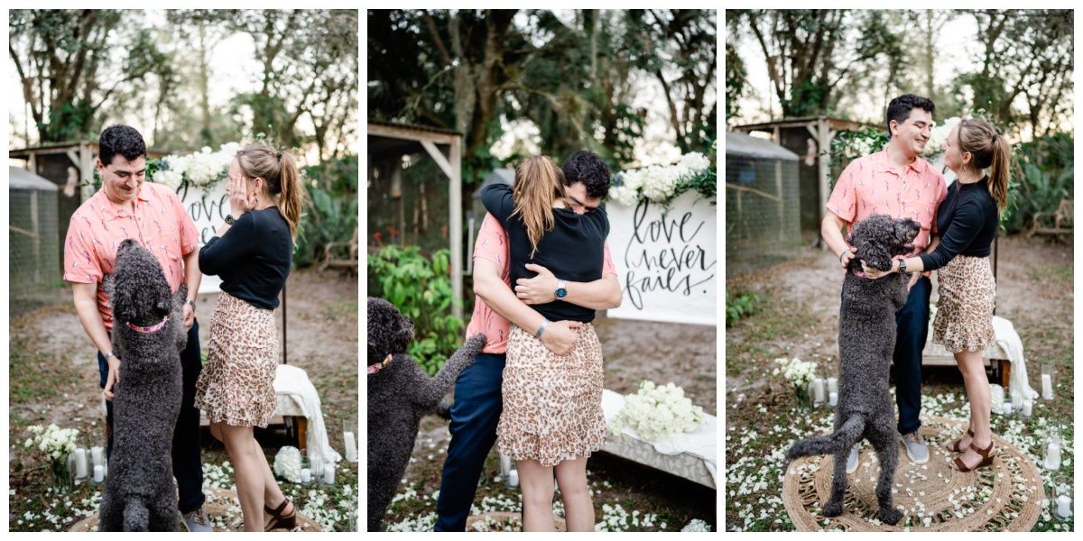 couple embraces with dog during Naples proposal