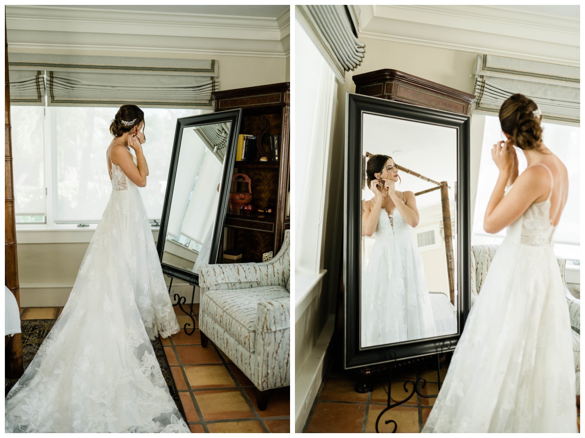 Florida bride gets ready in mirror in long lace a line bridal gown