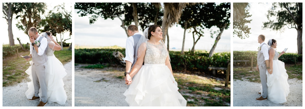 Bride and groom share wedding day first touch on the beach. Photographed by Bonita Springs wedding photographer