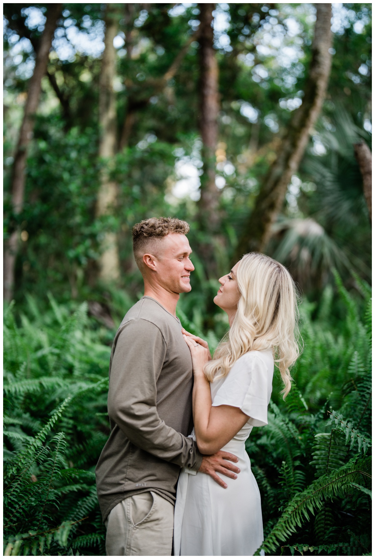 Couple embraces and laughs during Fort Myers engagement session