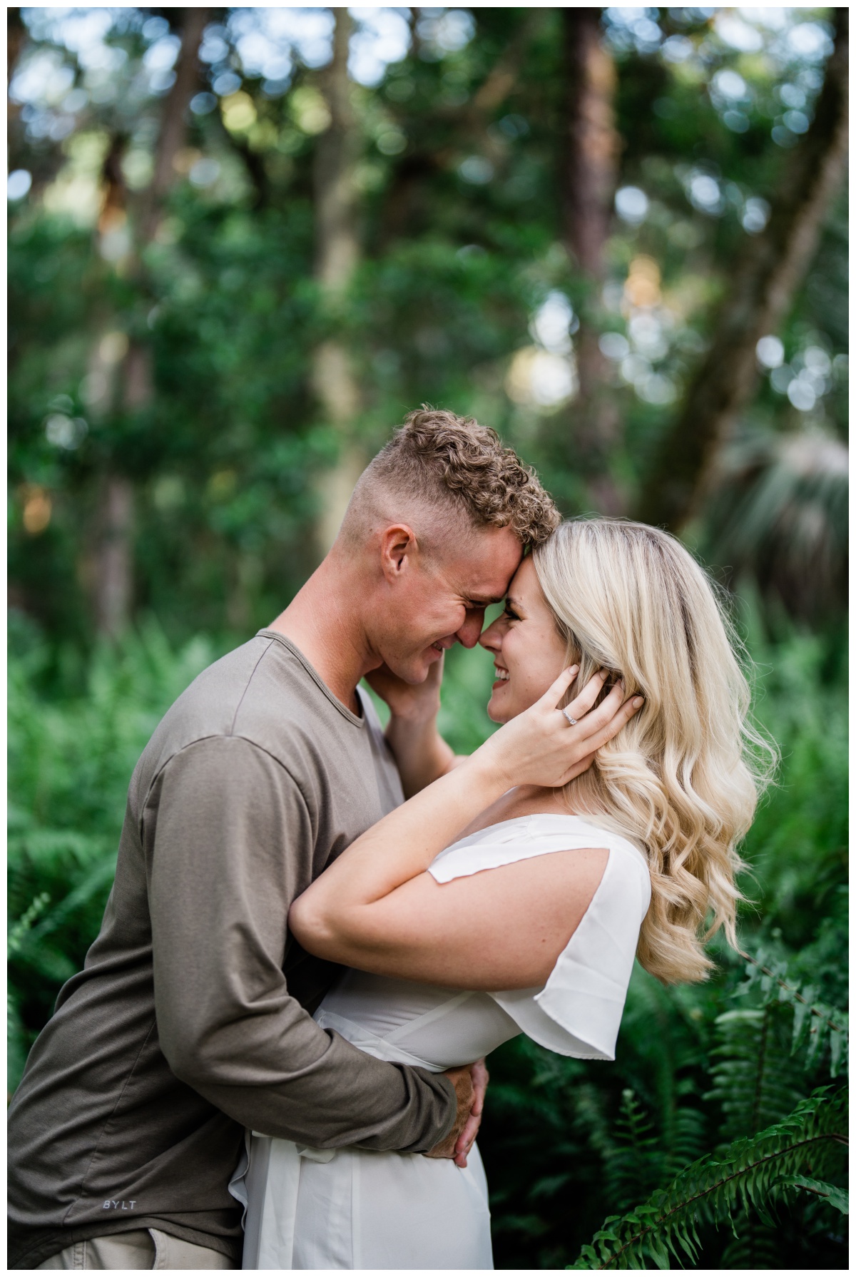 Couple embraces and laughs during Fort Myers engagement session