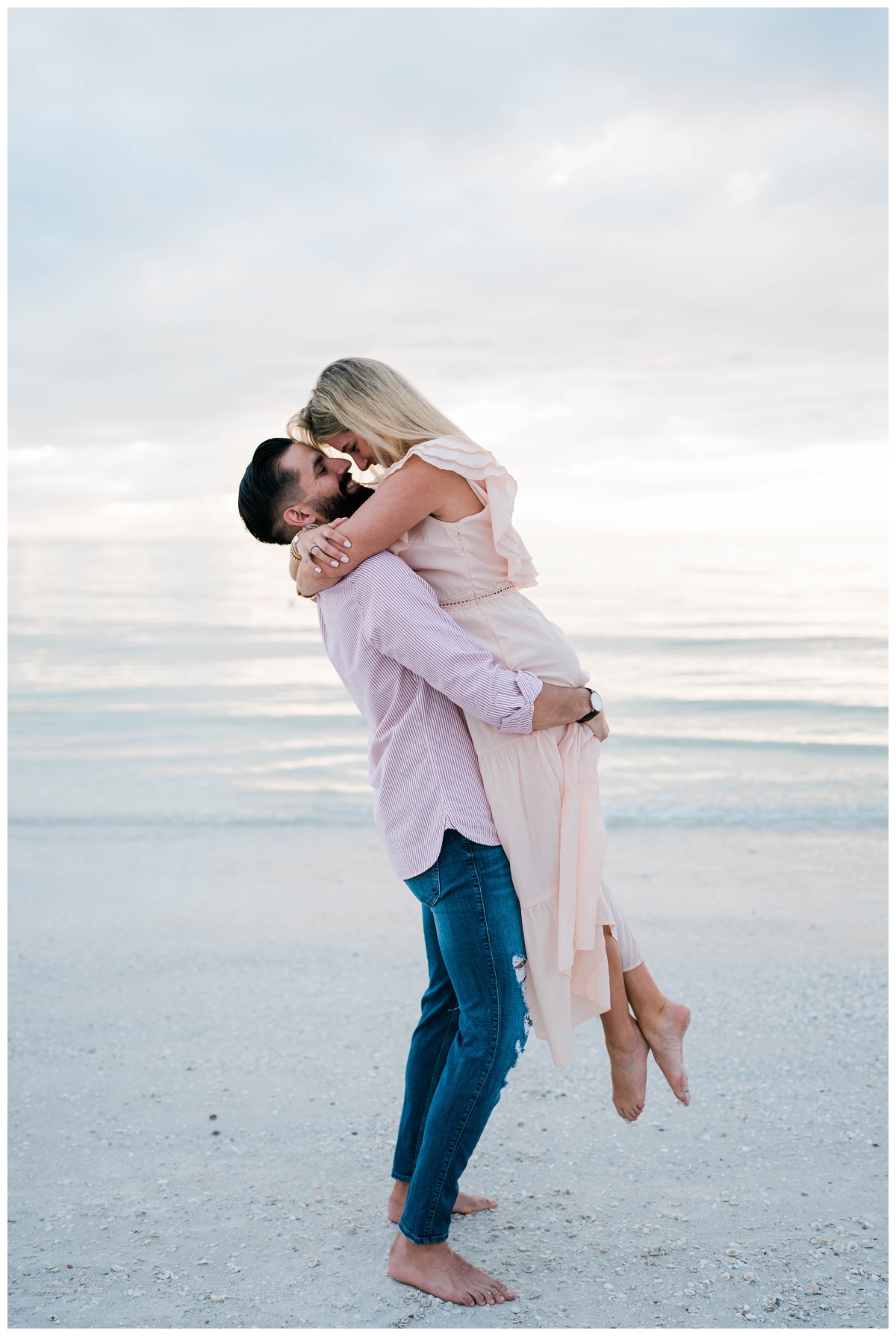 engaged couple embraces on the beach during sunset at Marco Island engagement photoshoot by Fort Myers wedding photographer