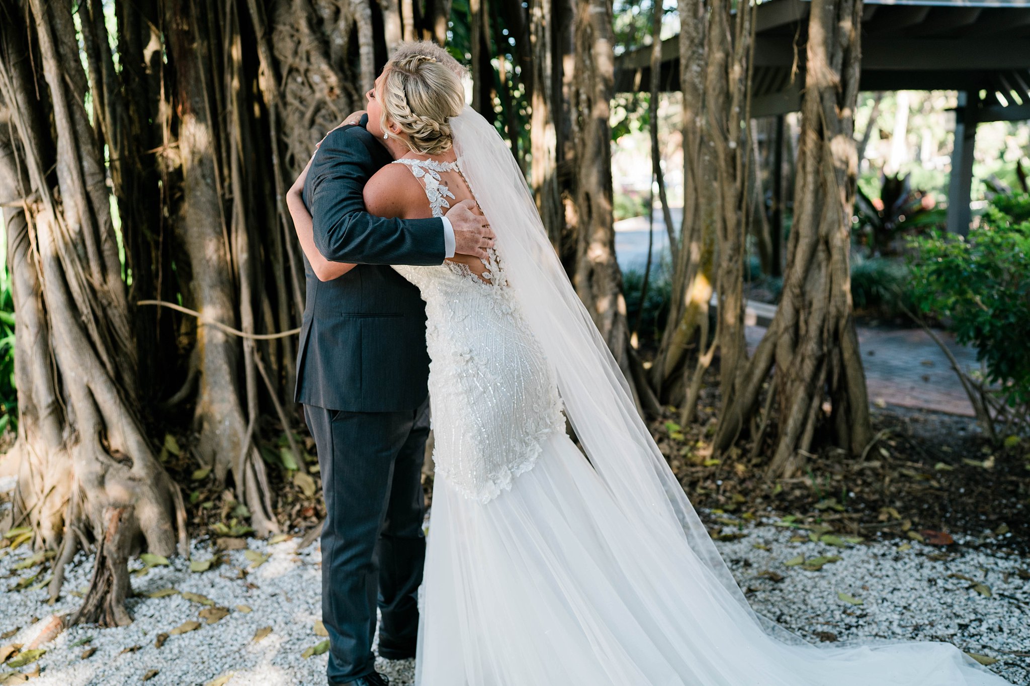 father cries tears of joy during father daughter first look during Southwest Florida wedding day