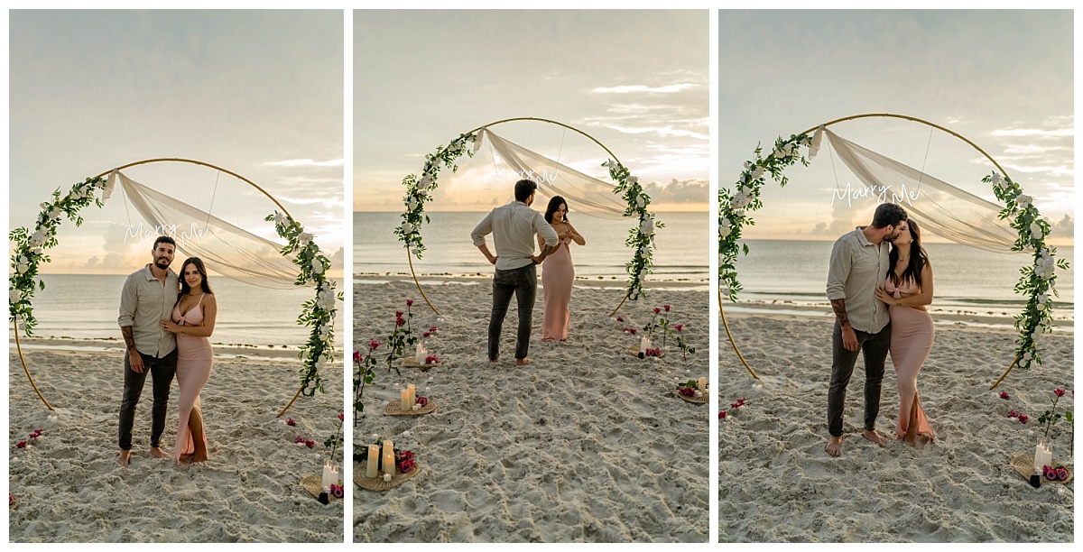 archway and florals line the beach for sunset proposal in Southwest Florida