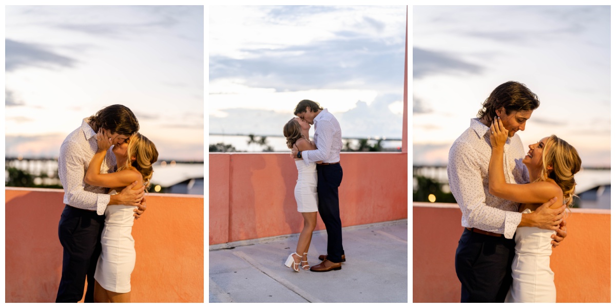 south florida engaged couple kisses atop rooftop downtown during sunset