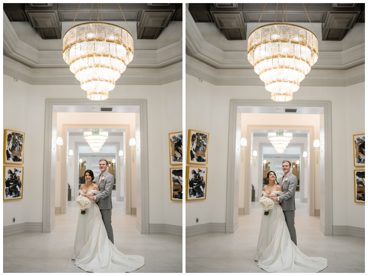 couple embraces under chandelier at modern style naples wedding venue 